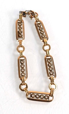 Lot 619 - A yellow metal fancy link bracelet, l. 20 cm,...