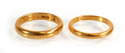 Lot 620 - A 22ct yellow gold wedding band, Birmingham...