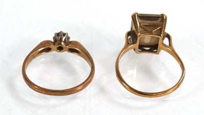 Lot 621 - A 9ct yellow gold ring set small diamond in an...