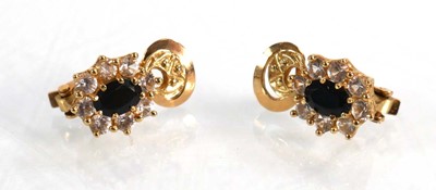 Lot 626 - A pair of 14ct yellow gold ear clips, each set...