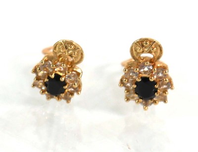 Lot 626 - A pair of 14ct yellow gold ear clips, each set...