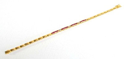 Lot 630 - An 18ct yellow gold tennis type bracelet set...