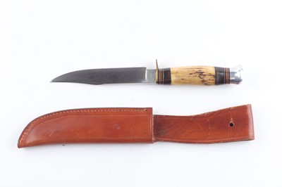 Lot 1002 - Sheath knife with 5 ins clip pointed blade the...