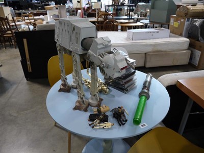 Lot 1033 - Star Wars collectibles incl. lightsabre, VHS,...