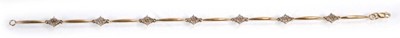 Lot 632 - A 9ct yellow gold bracelet set seven sections...