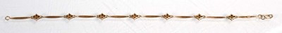 Lot 632 - A 9ct yellow gold bracelet set seven sections...