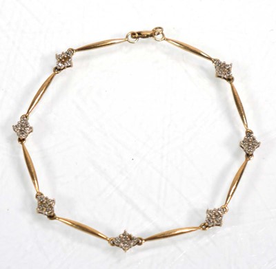 Lot 632 - A 9ct yellow gold bracelet set seven sections...