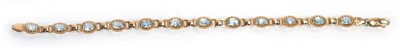 Lot 633 - A 9ct yellow gold bracelet set twelve sections...