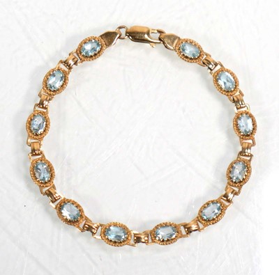 Lot 633 - A 9ct yellow gold bracelet set twelve sections...