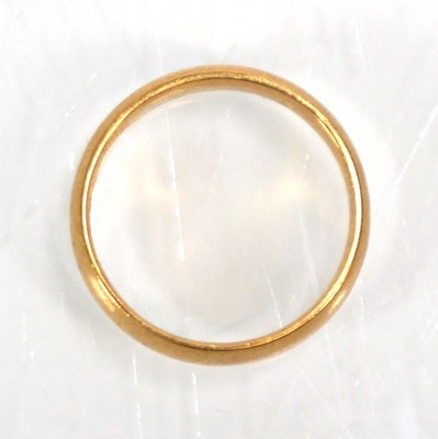 Lot 635 - An 18ct yellow gold wedding band, Sheffield...