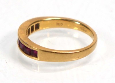 Lot 636 - An 18ct yellow gold half eternity ring set...