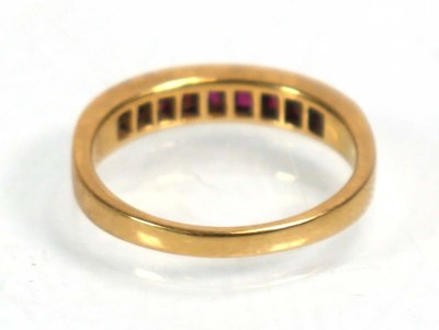 Lot 636 - An 18ct yellow gold half eternity ring set...