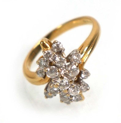 Lot 638 - An 18ct yellow gold cluster ring set seventeen...