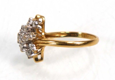Lot 638 - An 18ct yellow gold cluster ring set seventeen...