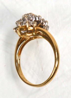 Lot 638 - An 18ct yellow gold cluster ring set seventeen...