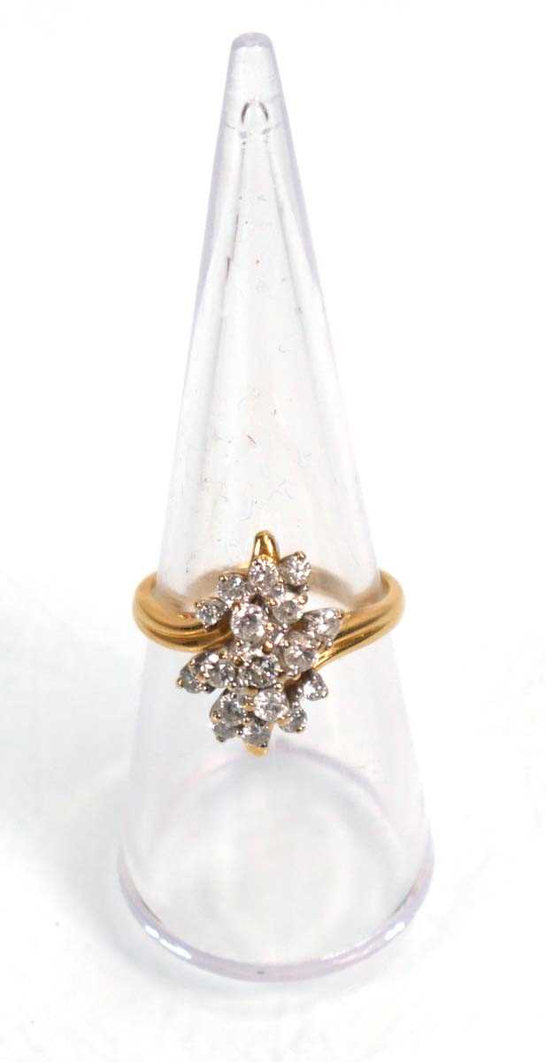 Lot 638 - An 18ct yellow gold cluster ring set seventeen...