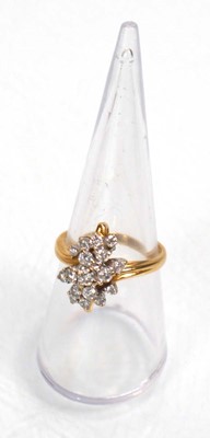 Lot 638 - An 18ct yellow gold cluster ring set seventeen...