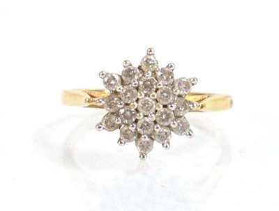 Lot 639 - An 18ct yellow gold cluster ring set nineteen...