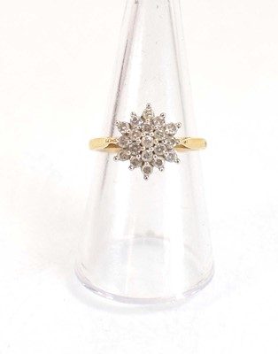 Lot 639 - An 18ct yellow gold cluster ring set nineteen...