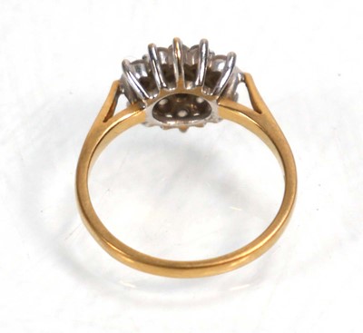 Lot 639 - An 18ct yellow gold cluster ring set nineteen...