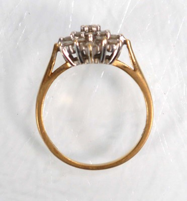 Lot 639 - An 18ct yellow gold cluster ring set nineteen...