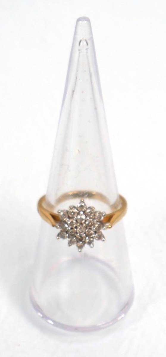 Lot 639 - An 18ct yellow gold cluster ring set nineteen...