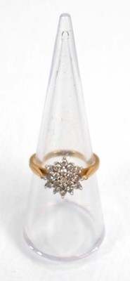 Lot 639 - An 18ct yellow gold cluster ring set nineteen...