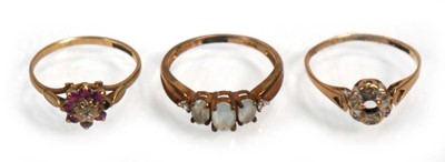 Lot 642 - Three 9ct yellow gold dress rings including...