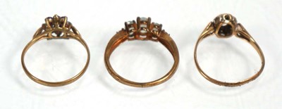 Lot 642 - Three 9ct yellow gold dress rings including...