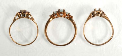 Lot 642 - Three 9ct yellow gold dress rings including...