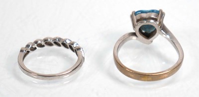 Lot 643 - A 14ct white gold ring set heart shaped blue...