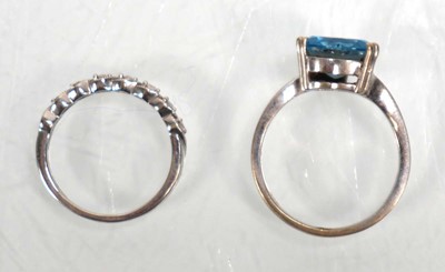 Lot 643 - A 14ct white gold ring set heart shaped blue...