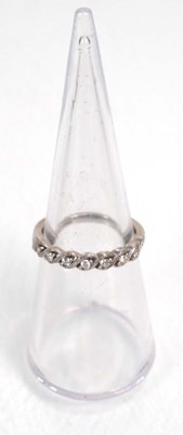 Lot 643 - A 14ct white gold ring set heart shaped blue...