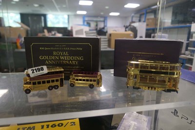 Lot 2190 - 2 gold diecast vehicles, the Queen Elizabeth...