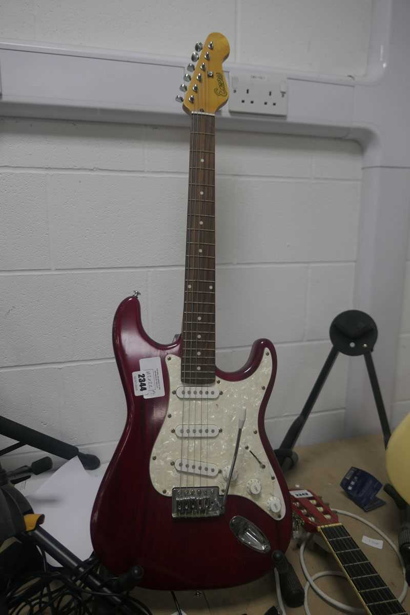 Lot 2344 - Encore 6 string electric guitar in burgundy...