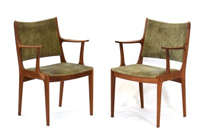 Lot 14 - A pair of 1960's teak framed elbow chairs with...