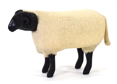 Lot 19 - An ebonised and synthetic wool 'Bo-Peep Sheep'...