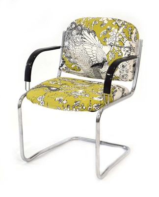 Lot 38 - A 1970's Bauhaus-style elbow chair, the floral...