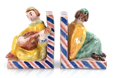 Lot 140 - A pair of figural glazed stoneware bookends by...