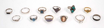 Lot 648 - Twelve silver dress rings including an half...