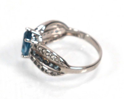 Lot 648 - Twelve silver dress rings including an half...