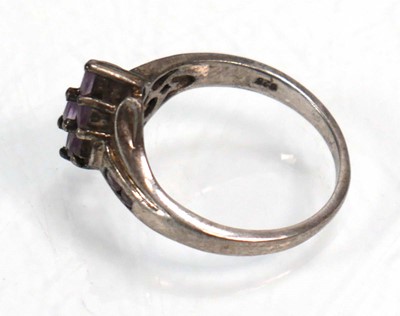 Lot 648 - Twelve silver dress rings including an half...