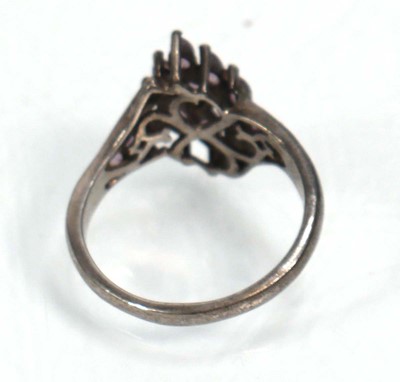 Lot 648 - Twelve silver dress rings including an half...