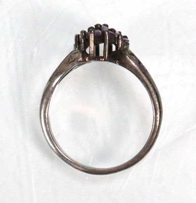 Lot 648 - Twelve silver dress rings including an half...