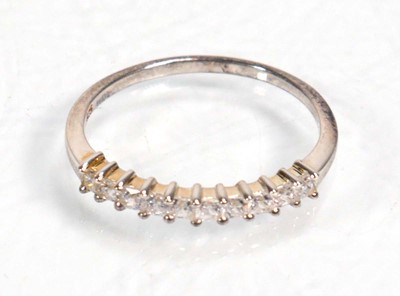 Lot 648 - Twelve silver dress rings including an half...