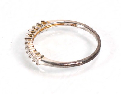 Lot 648 - Twelve silver dress rings including an half...