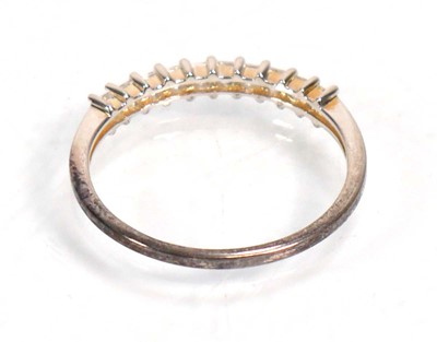 Lot 648 - Twelve silver dress rings including an half...