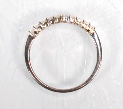 Lot 648 - Twelve silver dress rings including an half...