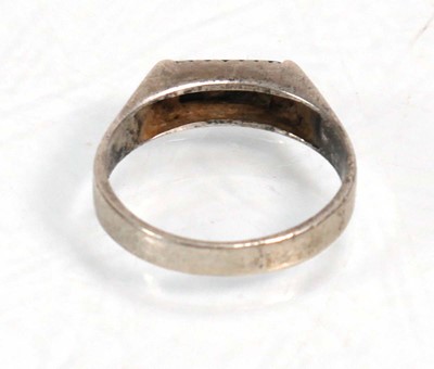 Lot 648 - Twelve silver dress rings including an half...