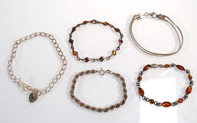 Lot 649 - A group of silver and metalware jewellery...
